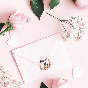 Floral Thank You stickers on a pink envelope for elegant gift packaging and sealing