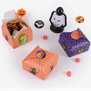 Halloween gift boxes featuring cartoon ghost and pumpkin patterns with seal stickers