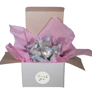 White gift box with gold Thank You sticker filled with silver foil wrapped chocolates