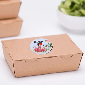 Floral Thank You stickers with red hearts on brown kraft paper packaging boxes