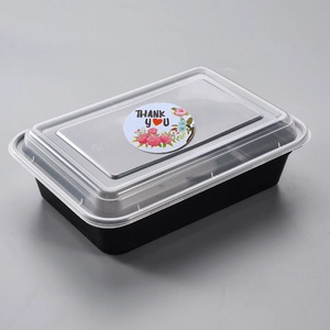Black rectangular food container with Thank You floral sticker and transparent lid