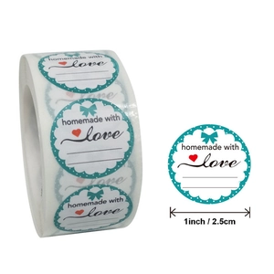 Roll of 1-inch Homemade with Love stickers with red heart and teal bow for gift wrapping
