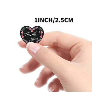 Floral heart-shaped Thank You stickers in black with pink accents, 1 inch diameter size