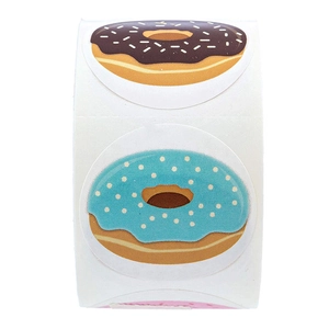 Roll of decorative donut stickers with chocolate and blue frosting designs for gift wrapping