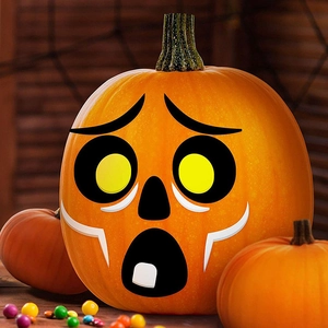 Halloween pumpkin face stickers set featuring funny facial expressions on a large orange pumpkin
