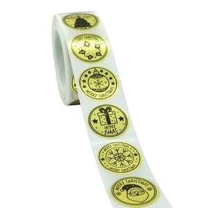 Roll of 8 golden Merry Christmas gift envelope seal stickers with black festive patterns