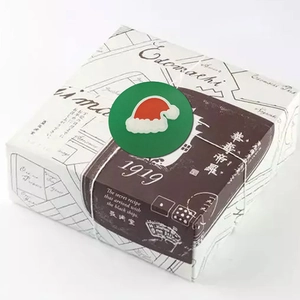 Christmas gift box with festive Merry Christmas cartoon sticker and vintage map design