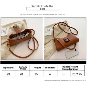 Tabella taglie dettagliata per borsa sottospalla in pelle marrone con misure in cm