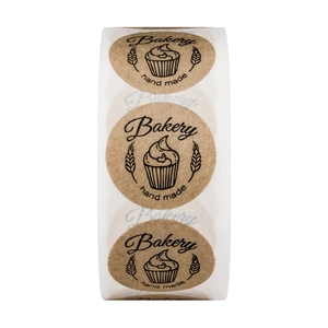Roll of round brown kraft paper stickers with cupcake design and Bakery hand made text
