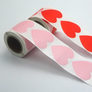 Roll of 1.5 inch pink and red heart adhesive stickers for Valentine gift packaging
