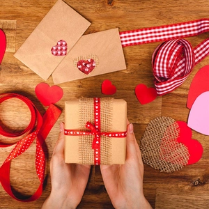 Brown kraft gift box with burlap and red heart ribbon for Valentine's Day present