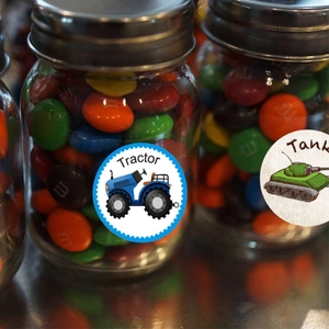 Round 1.5 inch tractor and tank toy car stickers on a glass candy jar for party decor