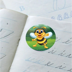 Round educational bee sticker for kids on notebook featuring a cute cartoon honeybee