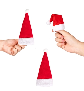 Mini red and white plush Christmas hats for table decor and cutlery set decorations