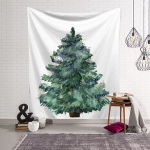 Detail of Christmas tree wall tapestry hanging on a white brick wall in a cozy room