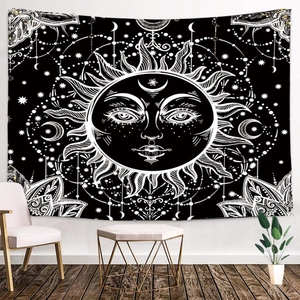 Detail view of moon and sun mandala tapestry hanging in a cozy bohemian living room