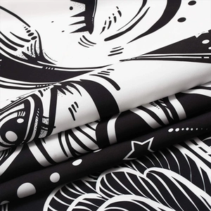 Bohemian mandala tapestry featuring high-contrast black and white abstract star patterns
