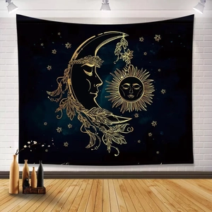 Detail of bohemian sun and moon tapestry hanging on a white brick wall in a living room