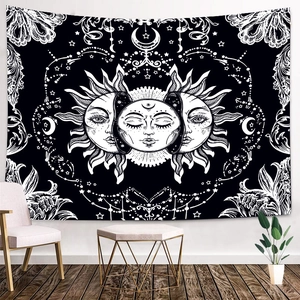 Black and white Sun and Moon Mandala tapestry hanging in a modern home living room decor
