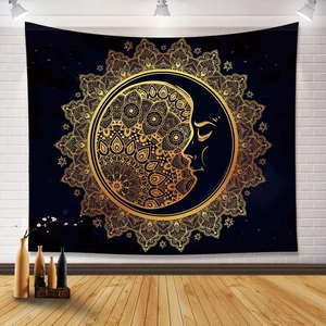 Macro detail of sun and moon mandala tapestry hanging on a white brick wall