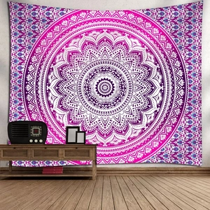 Detail of bohemian mandala tapestry featuring purple geometric patterns on a white wall