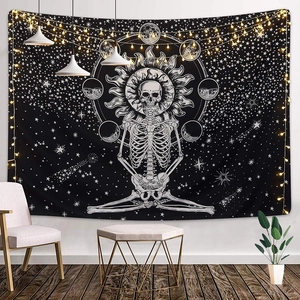 Detailed view of sun moon mandala tapestry with skeleton in bohemian interior setting