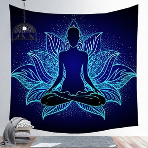 Detail of blue mandala tapestry with yoga silhouette and neon lotus hung on a wall