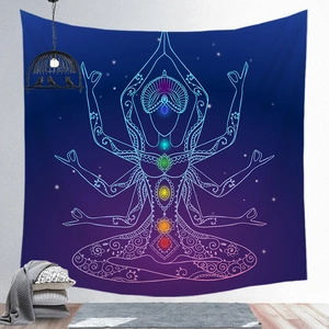 Detail of blue and purple chakra mandala tapestry with yoga figure in a zen home interior