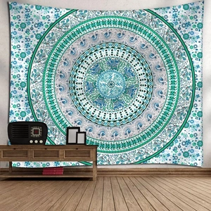 Detailed view of bohemian mandala tapestry hanging above a wooden cabinet for home decor