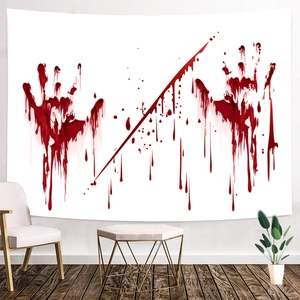 Detail of Halloween tapestry featuring realistic blood handprints on a white fabric backdrop