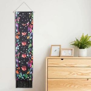 Vertical moon phase tapestry with floral moonlit pattern, wooden rod, and black tassels