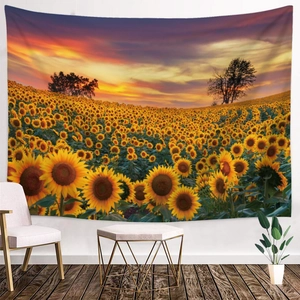 Detailed close-up of sunflower tapestry on wall with sunset landscape and floral patterns