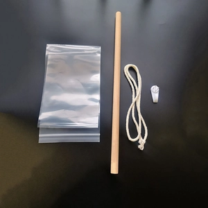 Detail view of Japanese tapestry hanging kit with wood rod, cotton rope, and wall hook