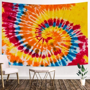 Close-up of vibrant tie-dye tapestry hanging in a modern living room setting