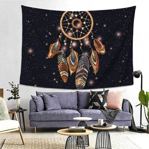 Detail of dreamcatcher tapestry with feathers hanging over a modern sofa in a cozy room