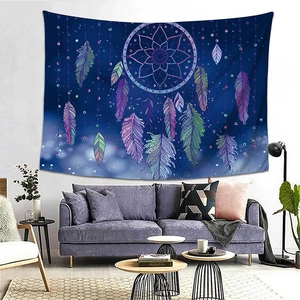 Detail of dreamcatcher tapestry with colorful feathers hung over a modern sofa