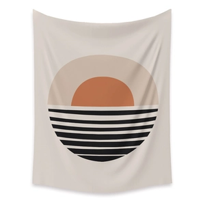 Close-up of minimalist sun and geometric stripe pattern on a decorative wall tapestry