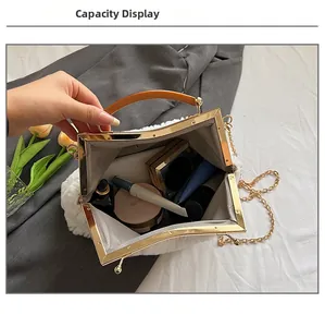 Detail showing internal capacity of the white plush evening bag with daily essentials