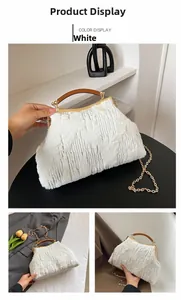 Detailed view of white faux fur evening bag with silver sequins and metal chain