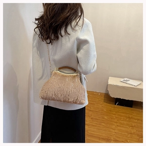 Chic khaki faux fur evening bag with gold metal frame and chain strap on shoulder