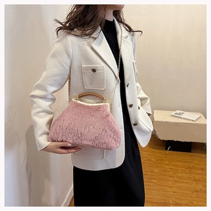 Pink faux fur evening bag featuring vintage wooden handles and golden chain strap detail