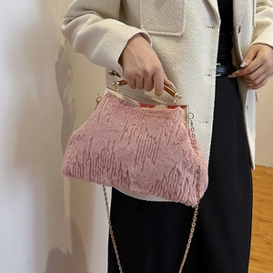 Chic pink faux fur evening clutch bag with wooden handle and gold chain strap