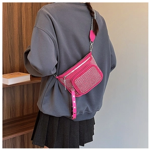 Detail of fuchsia rhinestone crossbody bag with silver studs and striped woven strap