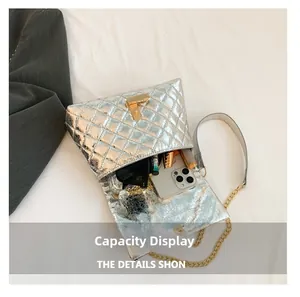 Detailed interior of the quilted silver bag showing large capacity for daily essentials