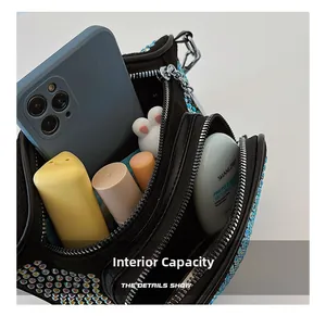 Detail view of the spacious internal capacity of the rhinestone crossbody handbag
