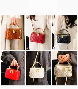 Six different colors of women's rivet box bags shown on model for style reference