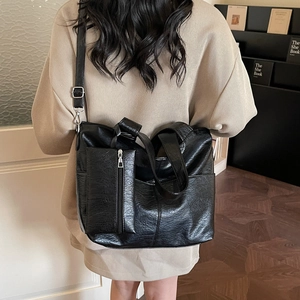 Large black vintage tote bag in glossy soft leather with a zipper coin purse for daily commute