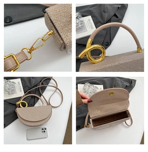 Detail view of woven champagne saddle bag with gold twisted handle and magnetic closure