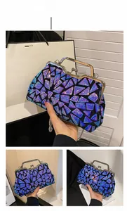 Detail of blue sequin evening bag featuring geometric patchwork and vintage metal handle