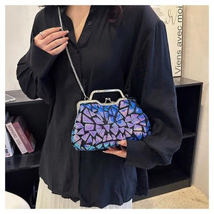 Close-up of geometric laser sequins and metal clasp on luxury evening clutch bag